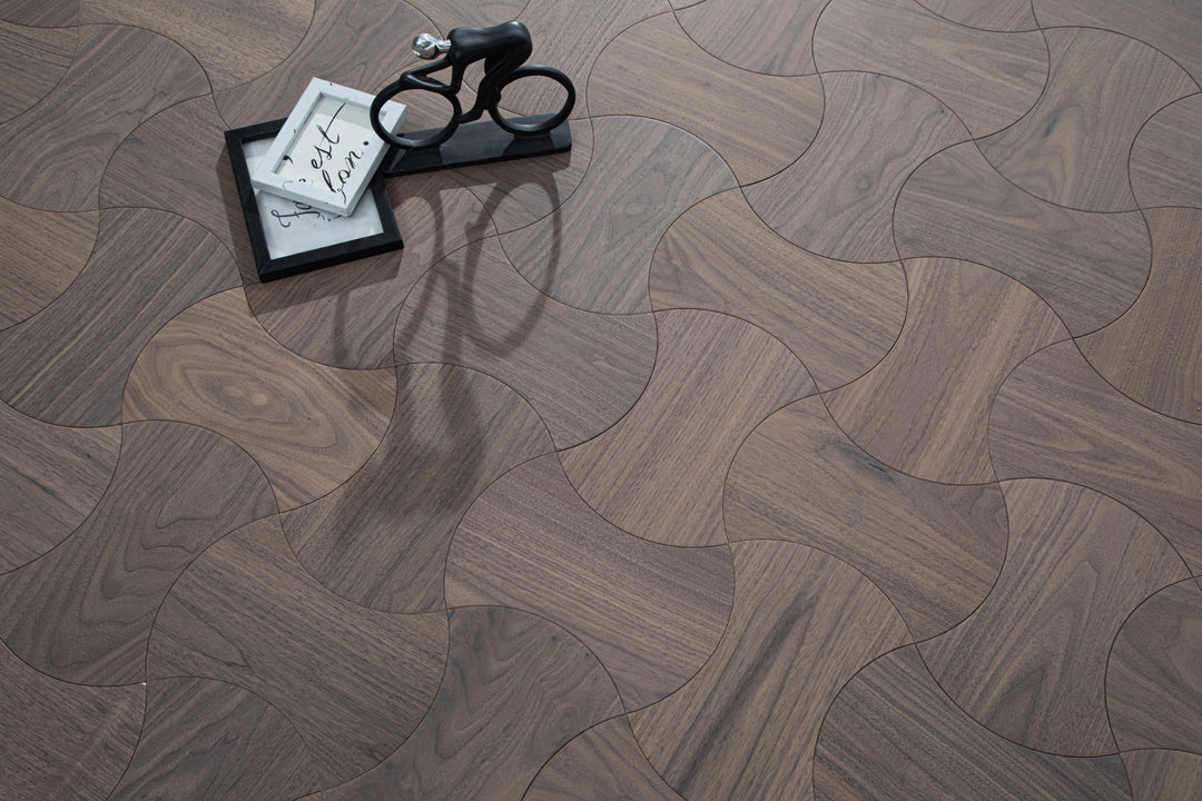 Wooden Flooring with intricate patterns and a dark finish, perfect for modern interiors.