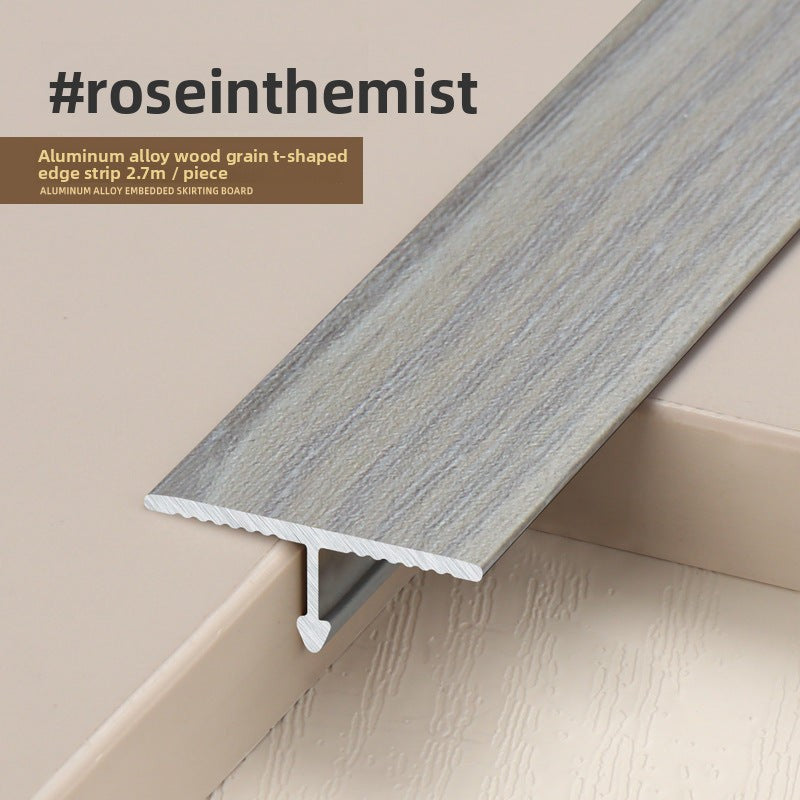 Rose in the Mist aluminum alloy edge strip with wood grain finish, ideal for flooring transitions.